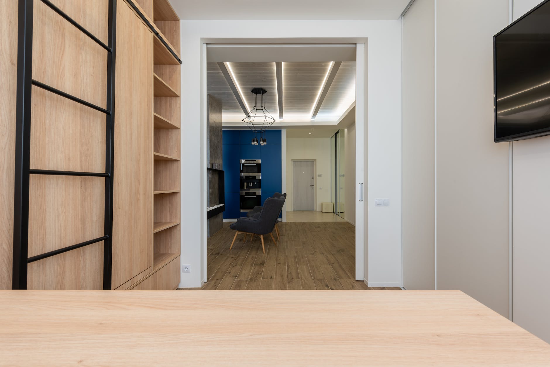 doorway separating study room from modern kitchen